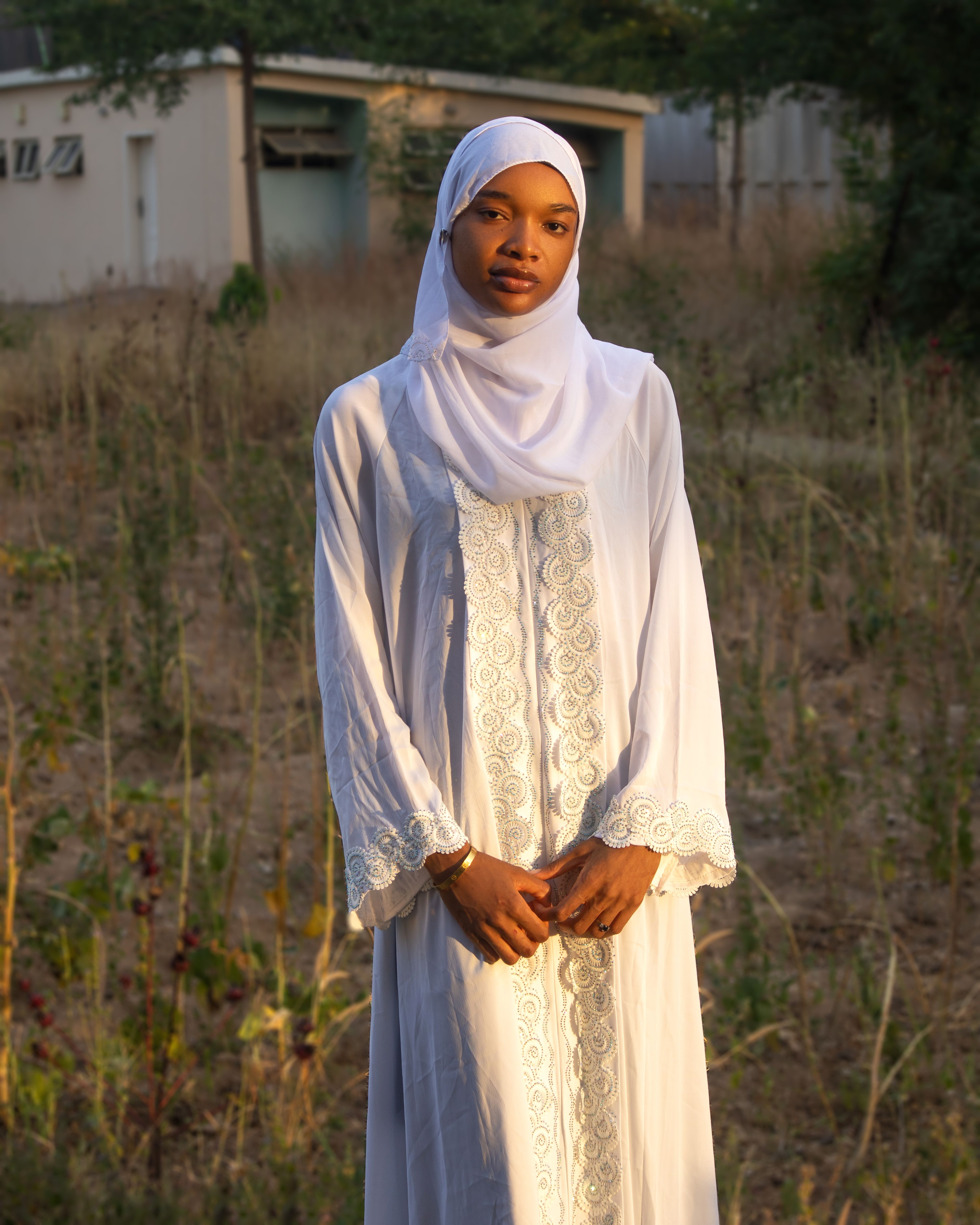 Beautiful Woman in Traditional White Hijab Outdoors · Free Stock Photo