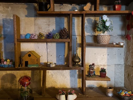 Rustic wooden shelf adorned with ornaments, plants, and decorative objects, creating a cozy indoor ambiance.