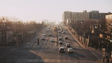 Urban Morning Commute on Sunny Road