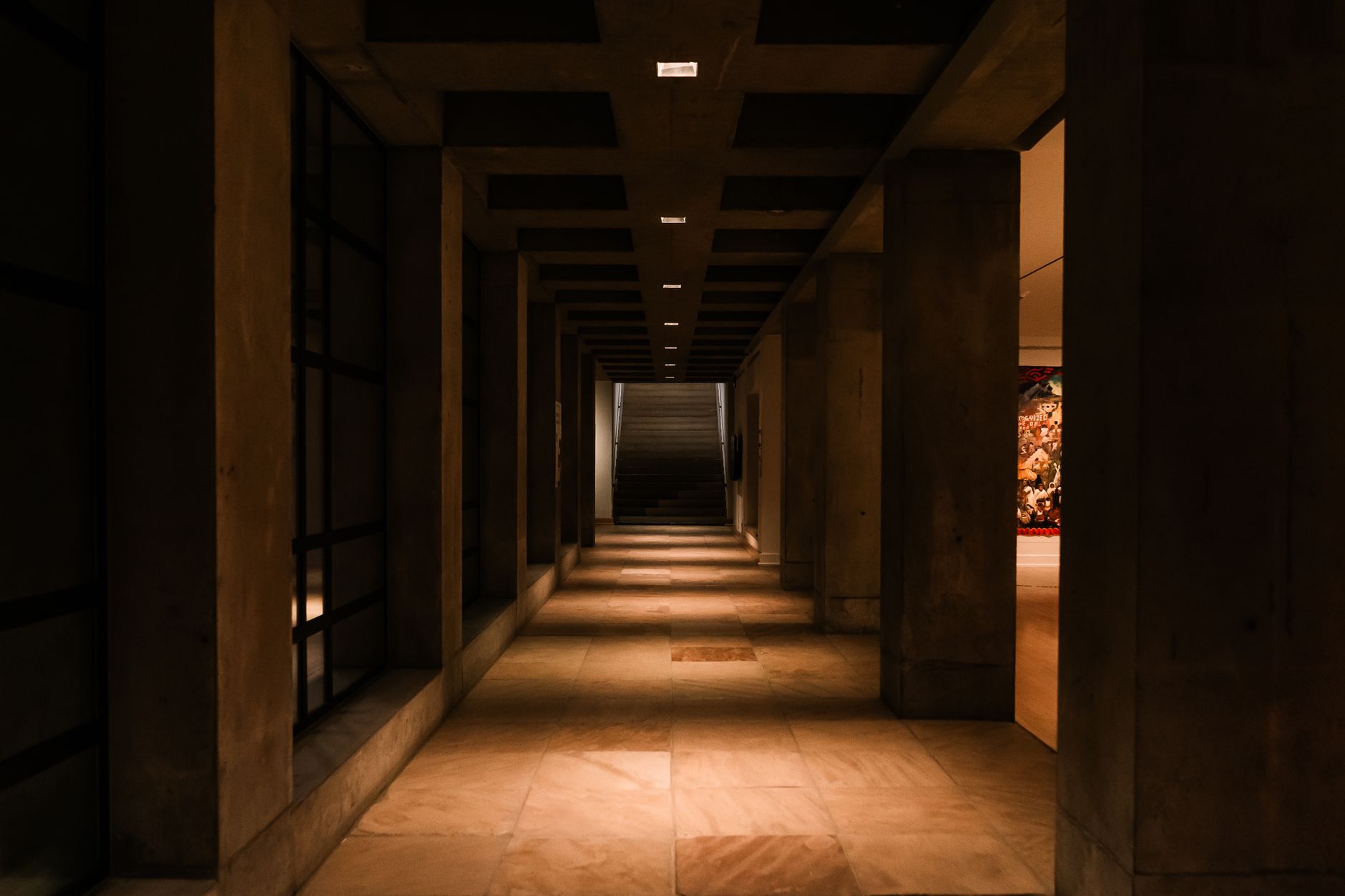Arizona courthouse hallway with statute books, prosecutor files, and a warning notice about cockfighting
