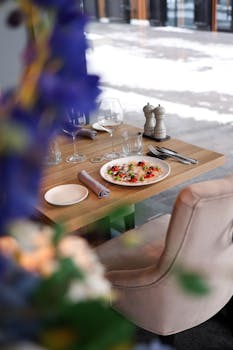A stylish dining table setup with a gourmet dish in an upscale restaurant setting.