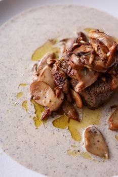 Delicious beef fillet served with a rich truffle mushroom sauce, perfect for gourmet dining.