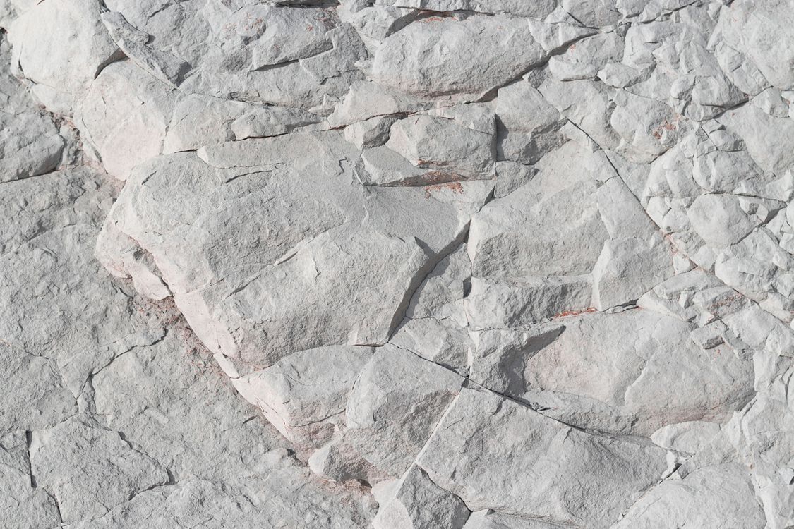 Whitestone Layer Close-up of textured white stone surface · Free Stock Photo