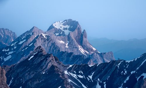 Free Stunning view of snow-capped alpine mountains at sunrise, showcasing nature's grandeur. Stock Photo