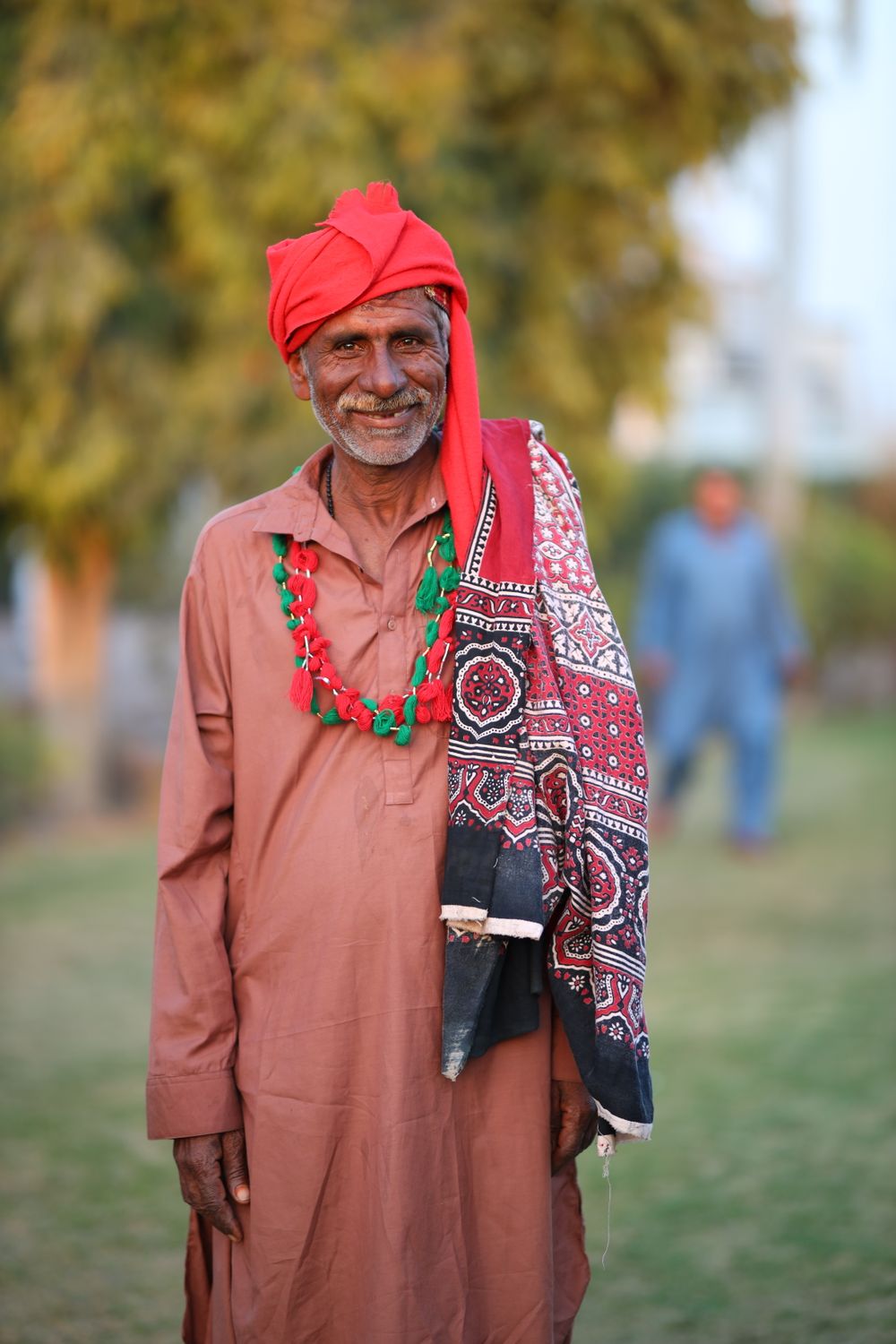 Elderly Man in Traditional Red Turban Outdoors · Free Stock Photo
