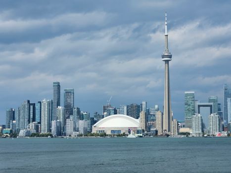 Stunning view of Toronto skyline featuring the iconic CN Tower and the Rogers Centre.