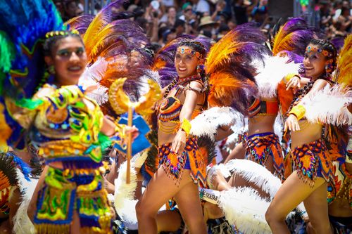 Free Colorful dancers in traditional costumes at a lively festival in Arica, Chile. Stock Photo