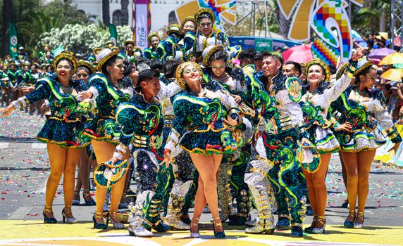 Colorful dancers celebrate in a street parade at Arica y Parinacota, Chile.