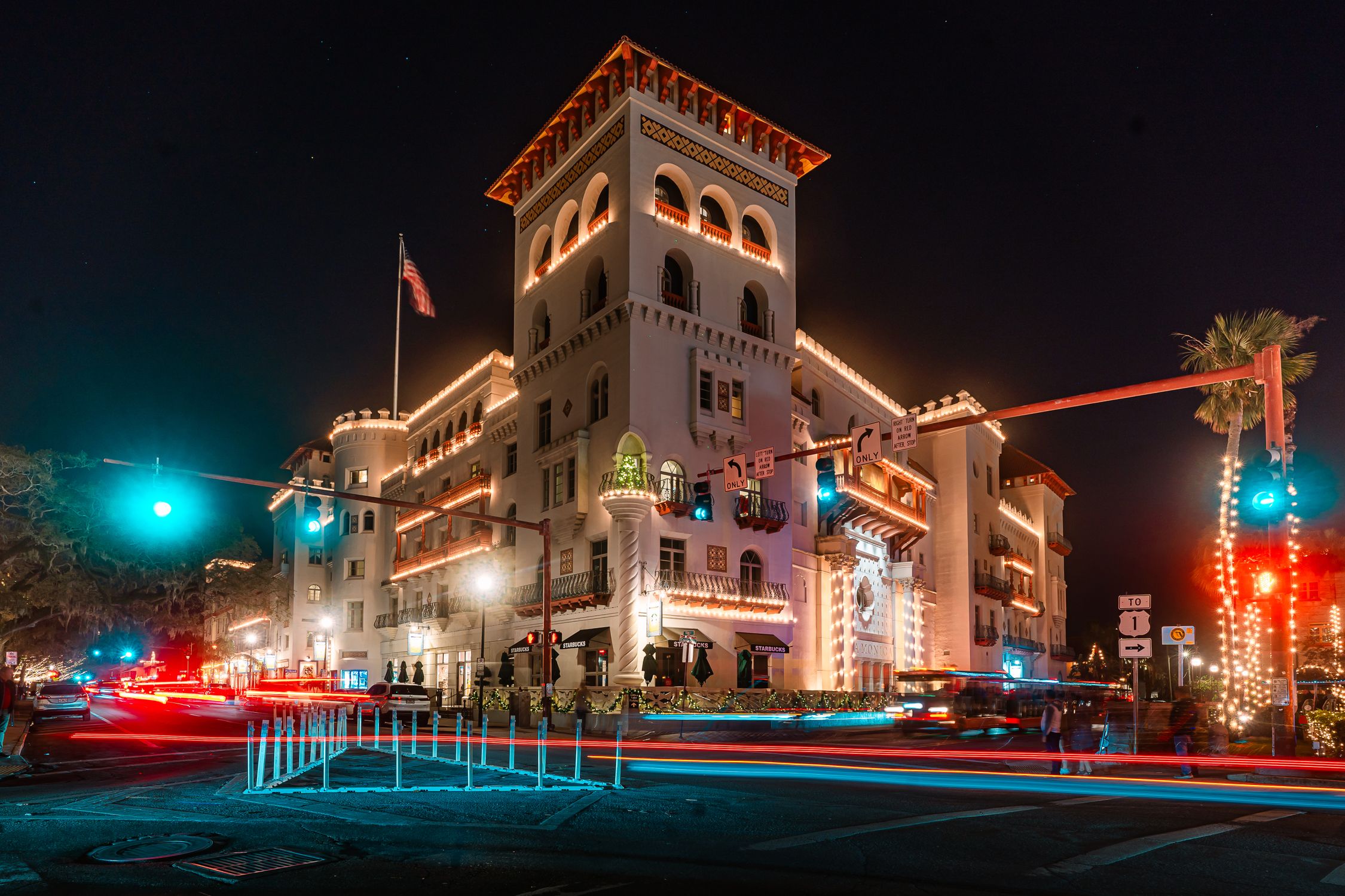 Long exposure of Casa Monica Hotel in St. Augustine, Florida, during festive night with bright lights.
