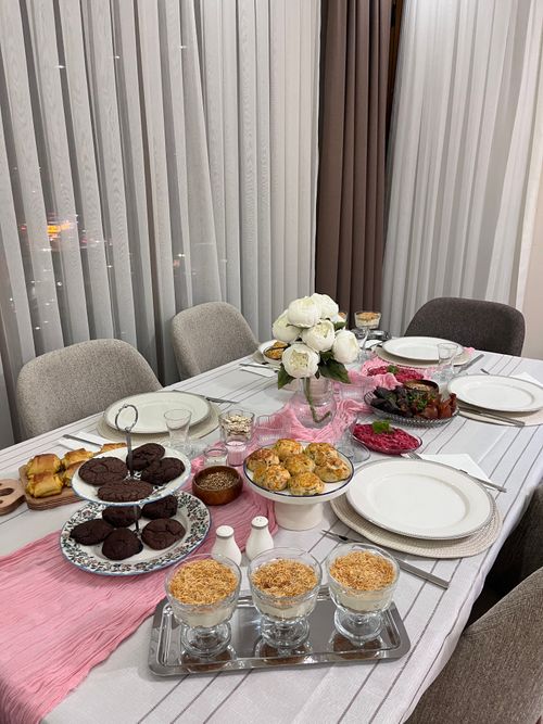 Free Beautifully arranged dinner table with a variety of desserts and decorations, perfect for gatherings. Stock Photo