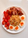Vibrant Asian-Style Meal with Sausages and Eggs