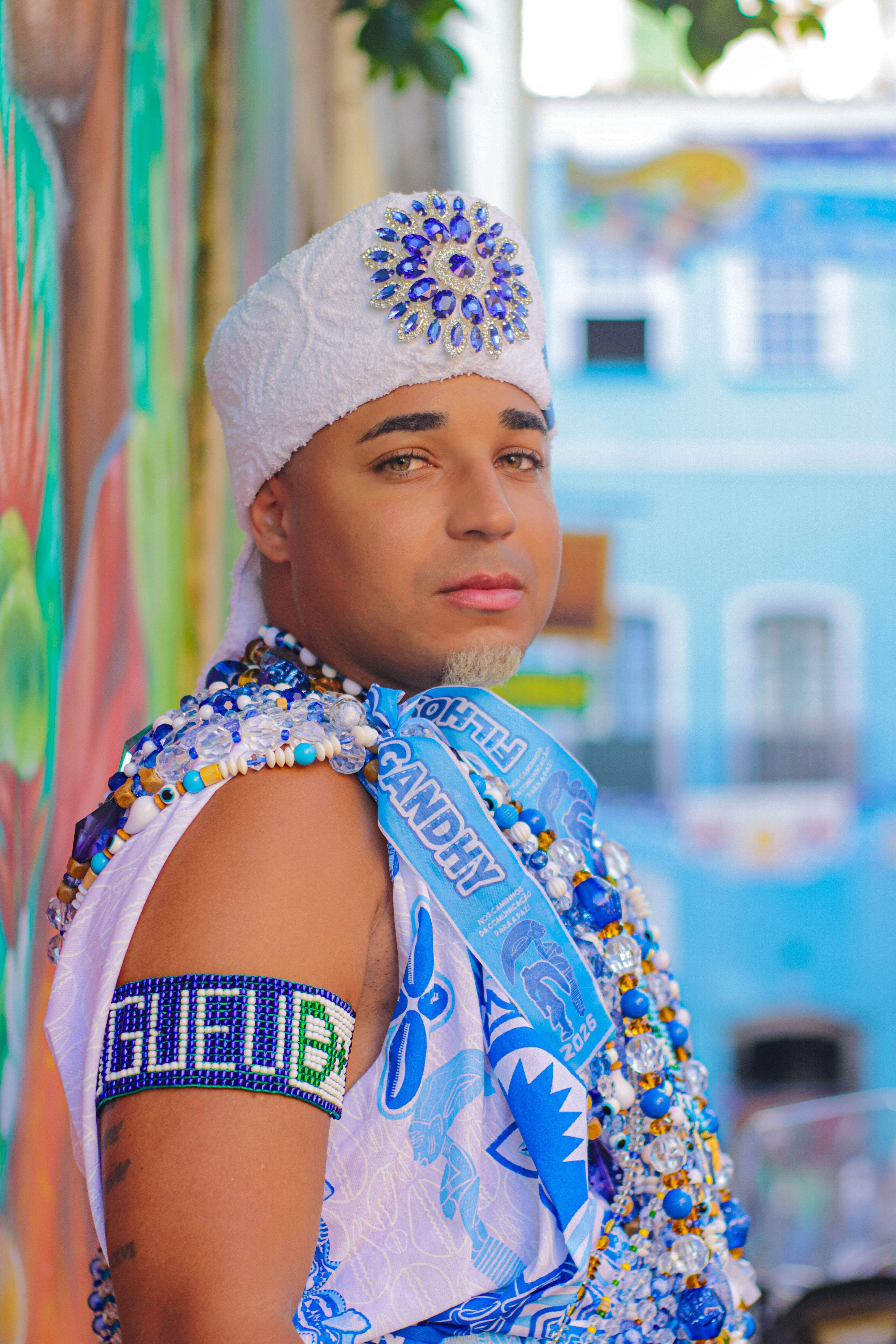Colorful portrait of a Carnival performer in traditional attire in Salvador, Brazil.