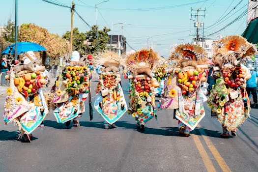 Colorful parade in Mexico with participants wearing fruit-laden costumes symbolizing harvest and tradition.