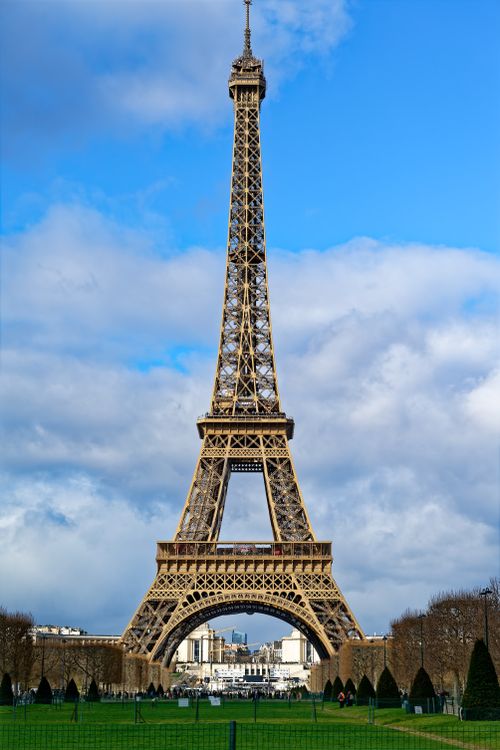 Free The iconic Eiffel Tower against a clear blue sky in Paris, France. Stock Photo