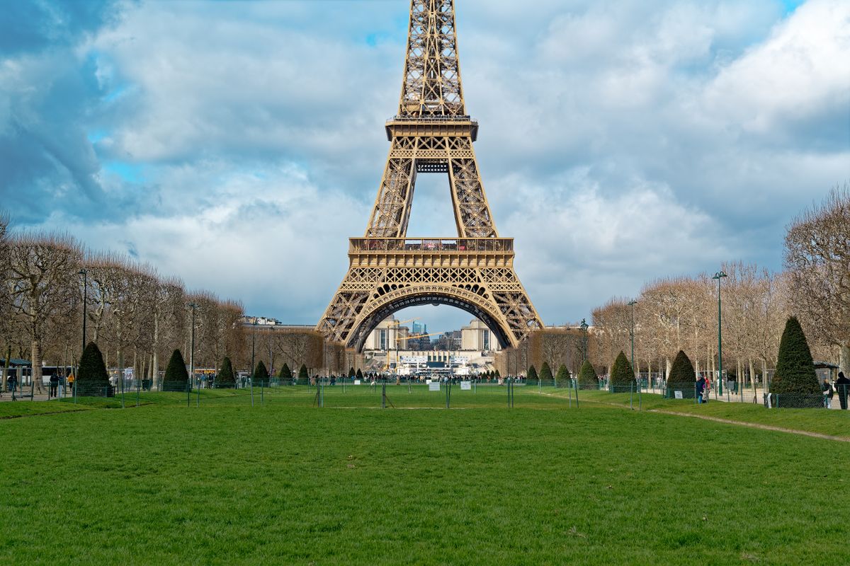 The Eiffel Tower rising above the Champ de Mars lawns, Paris