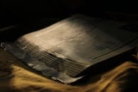 Dramatic Close-Up of Old Open Book in Low Light