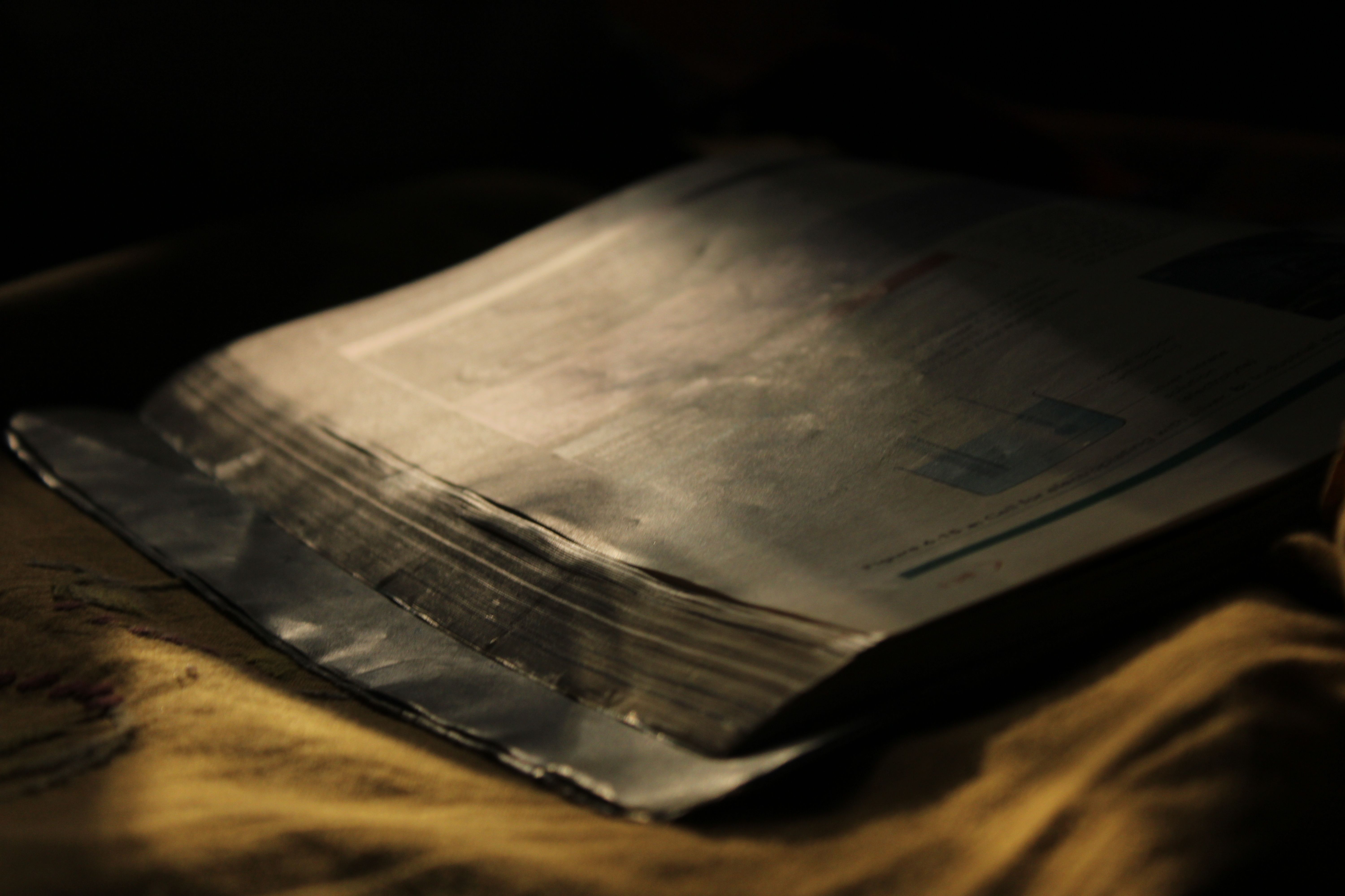 Old open book under warm low light