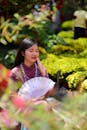 Elegant Woman in Traditional Dress with Fan