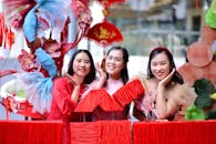 Smiling Women Celebrating Asian Lunar New Year Outdoors