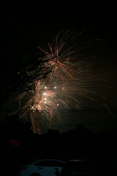 Free Vibrant fireworks exploding against a dark night sky, creating a spectacular display. Stock Photo