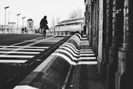 Black and White Urban Cyclist on City Street