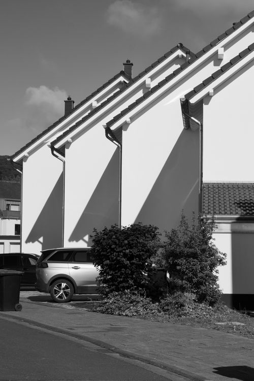 Free Elegant black and white photo of modern houses with dramatic shadows. Stock Photo