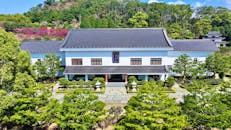 Traditional Japanese Architecture Amidst Lush Greenery