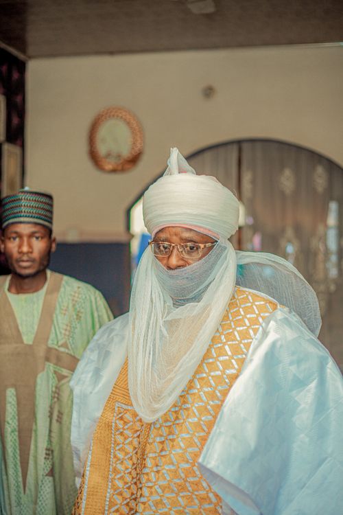 Free Portrait of two men in traditional African clothing indoors with ornate decor. Stock Photo