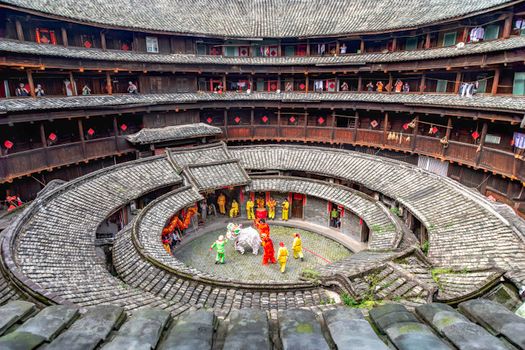 Colorful Lion Dance in Fujian Tulou, showcasing Chinese culture.