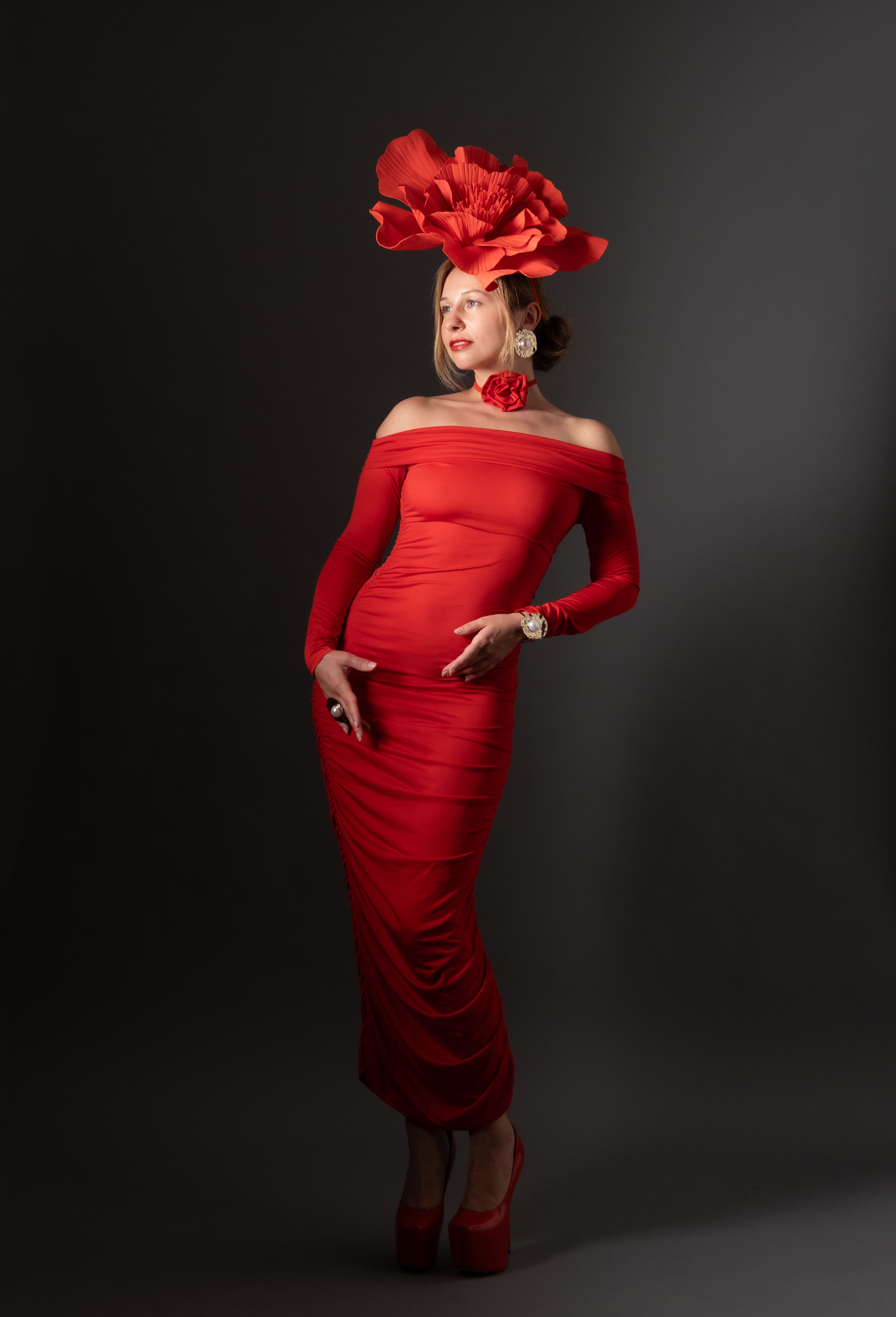 Elegant Woman in Red Dress with Bold Hat  Free Stock Photo
