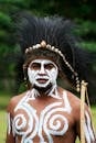 Tribal Man in Traditional Face Paint and Headdress