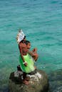 Children in Traditional Attire by the Sea