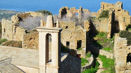 Free Explore historic stone ruins in Lumio, Corse, France with stunning sea views. Stock Photo