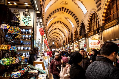 Free Colorful lamps and bustling crowd in Istanbul's historic Grand Bazaar, rich in culture and commerce. Stock Photo