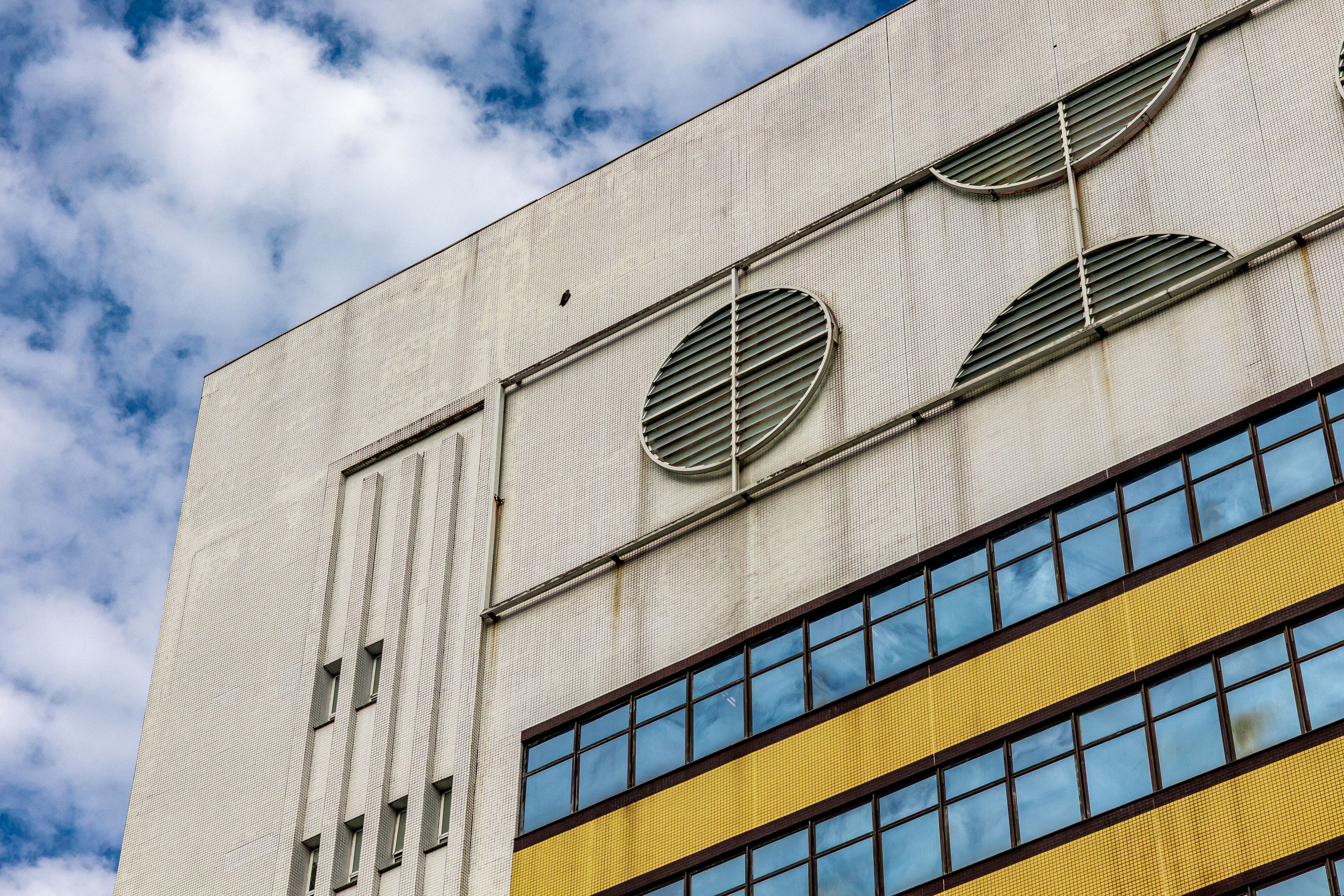 Modern Architectural Facade with Geometric Details · Free Stock Photo