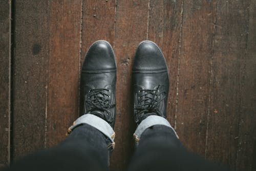 Free Photo Of Person Wearing Black Leather Shoes Stock Photo