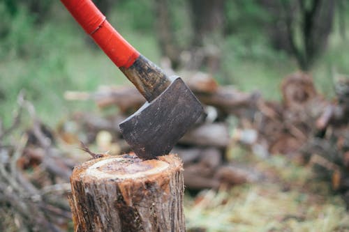 Free Photo Of Axe On Wooden Log Stock Photo
