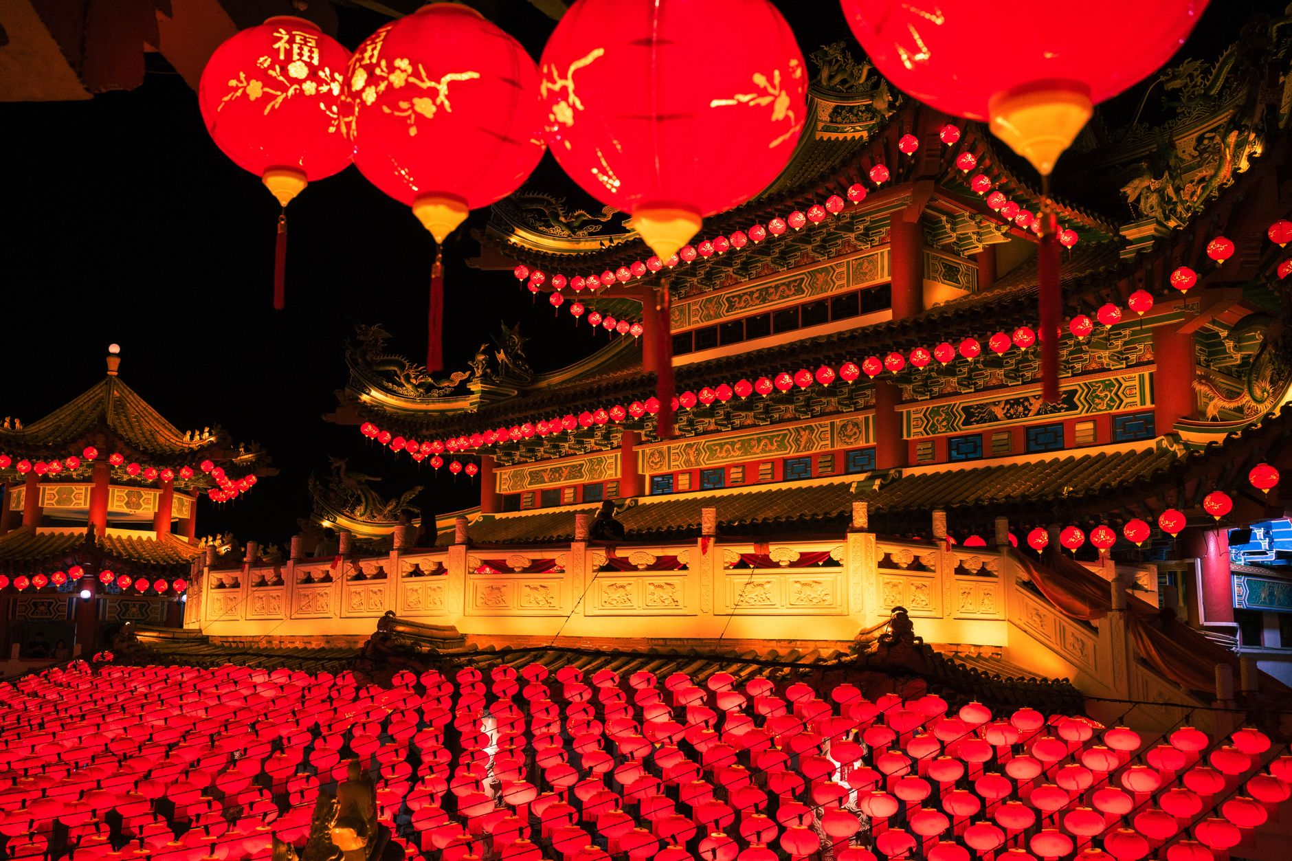 Stunning display of red lanterns at a traditional Chinese festival during nighttime.