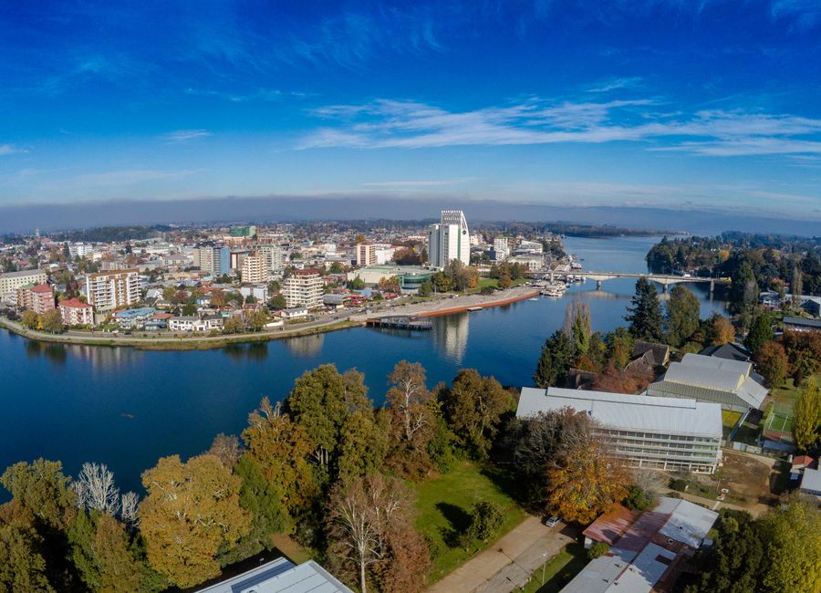 Stunning aerial panorama of Valdivia, Chile showcasing the city's skyline and surrounding nature.