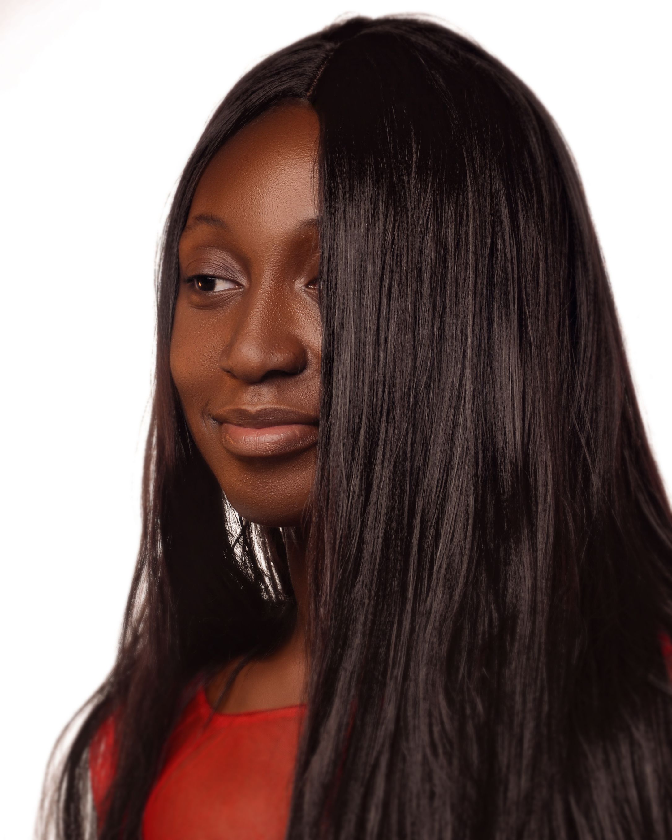 Portrait of a Woman with Long Hair in Red · Free Stock Photo
