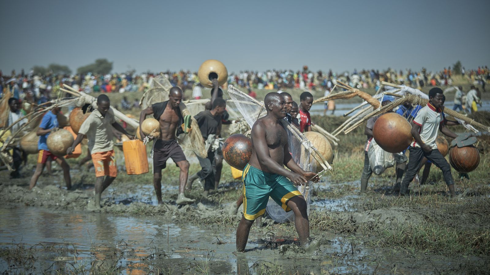 Men participating in traditional fishing festival, South Sudan