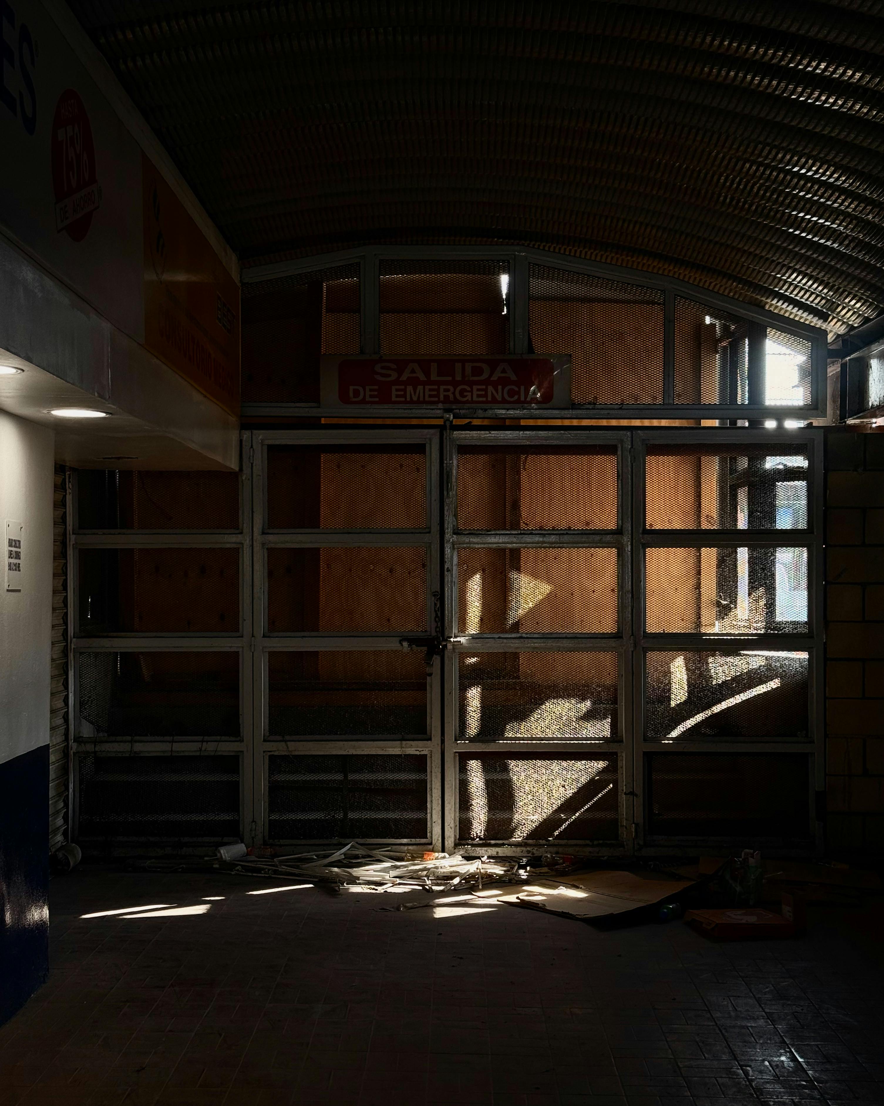 Free Dark, moody view of an empty emergency exit with sunlight filtering through, CDMX. Stock Photo