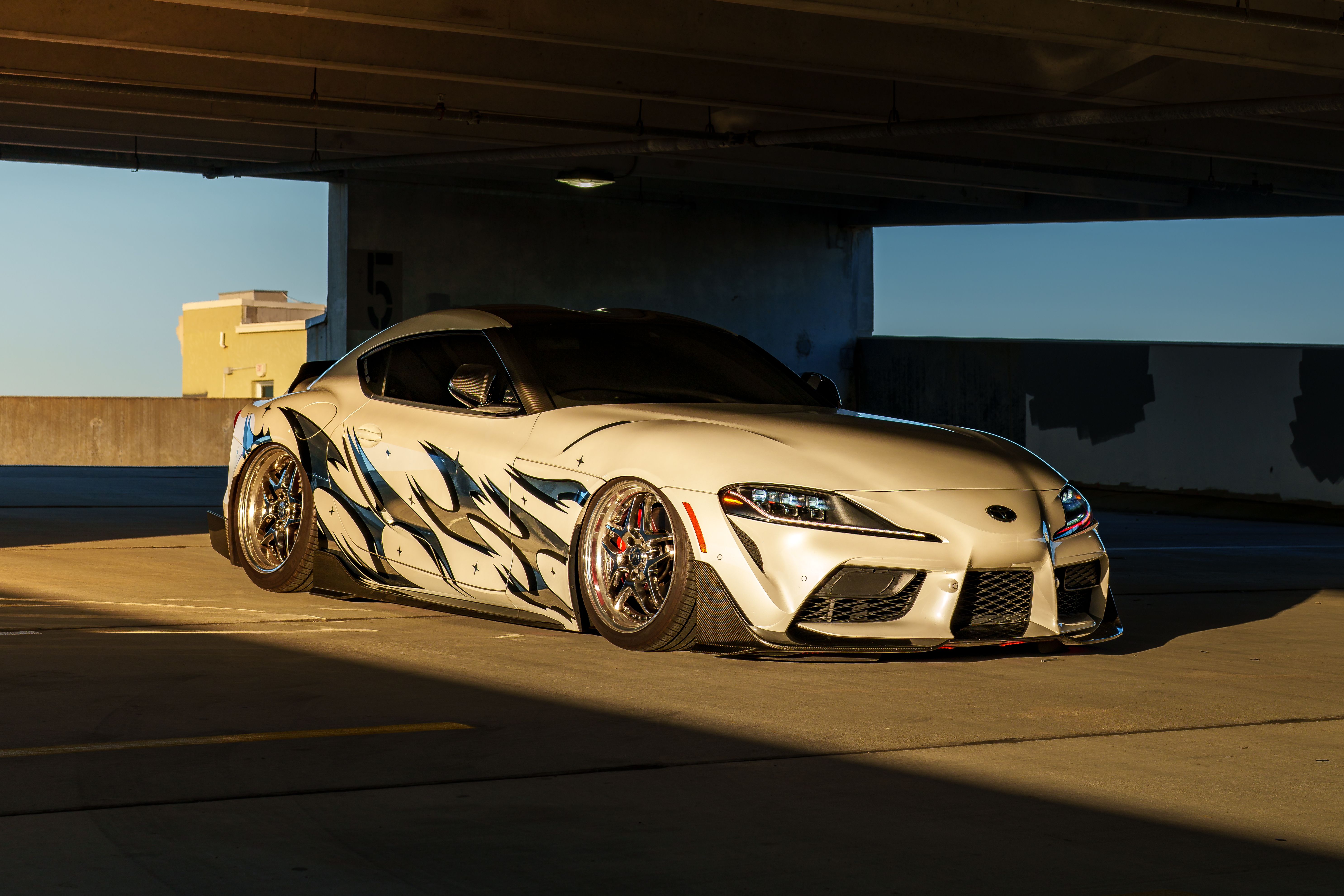 Sleek Custom Car in Urban Parking Garage · Free Stock Photo
