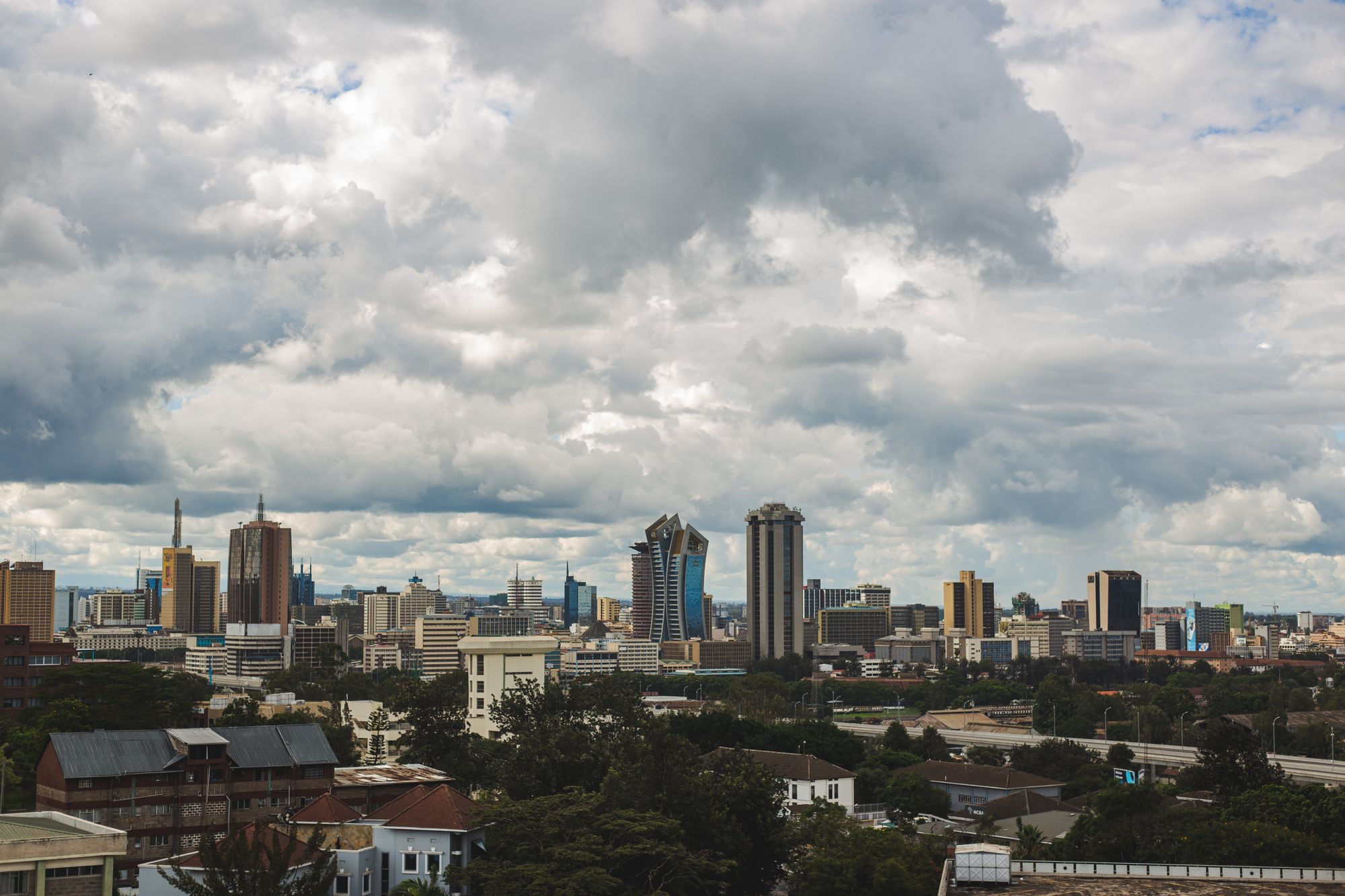 The Nairobi skyline under a towering cloudscape