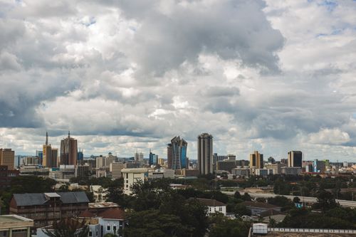 Free A stunning view of Nairobi's skyline under a dramatic sky. Stock Photo