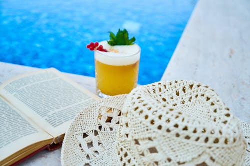 Clear Drinking Glass With Juice On A Poolside