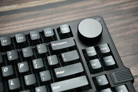 Detailed image showcasing a mechanical keyboard's keys and knob, ideal for tech enthusiasts.
