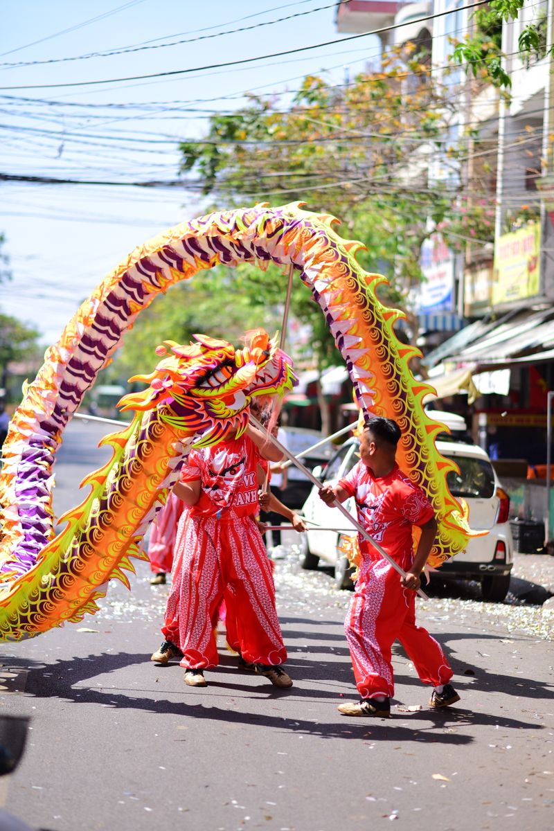 A vibrant dragon dance performed during a street celebration