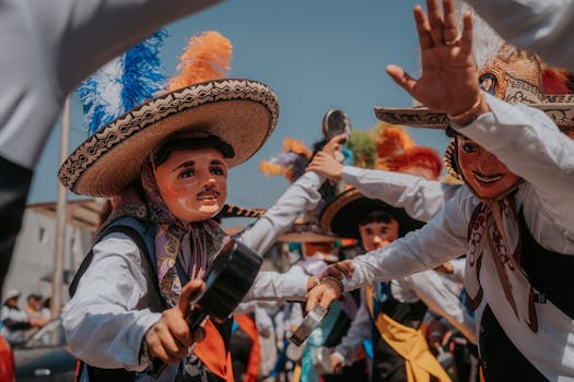 Colorful dancers in traditional costumes at a festival in Puebla, Mexico.