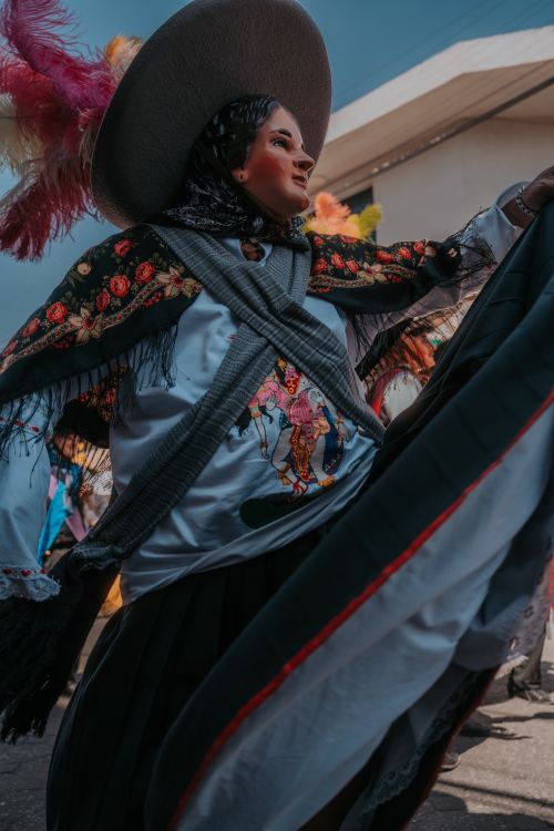 Free Colorful Mexican dancer performing outdoors with traditional attire in Puebla, Mexico. Stock Photo